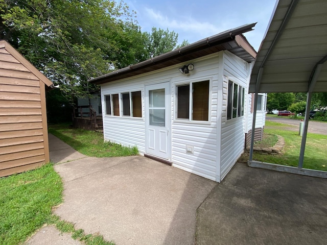 225 Jay St Unit 12, Sandstone, MN 55072 - view of front of house with a patio
