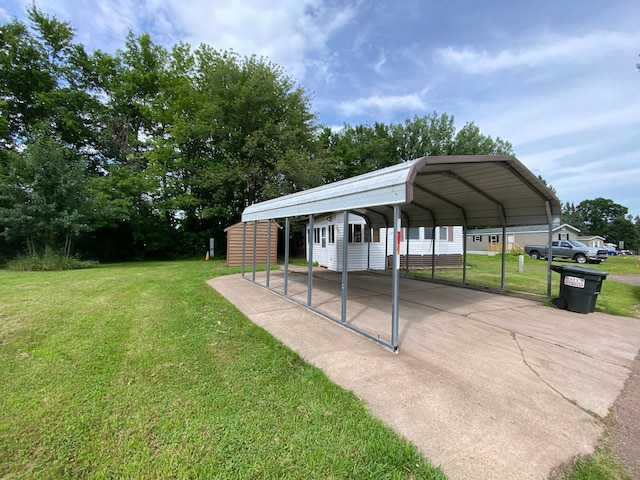 225 Jay St Unit 12, Sandstone, MN 55072 - view of car parking with a detached carport and concrete driveway