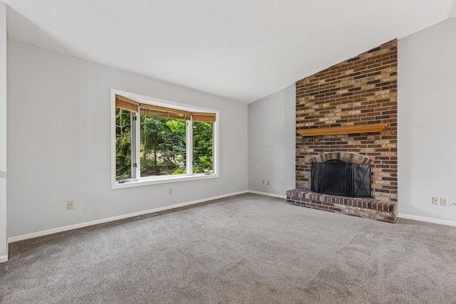 551 Townes Rd, Minnetonka, MN 55391 - unfurnished living room featuring carpet, lofted ceiling, and a brick fireplace