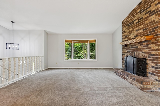 551 Townes Rd, Minnetonka, MN 55391 - unfurnished living room with a chandelier, carpet, a brick fireplace, and vaulted ceiling