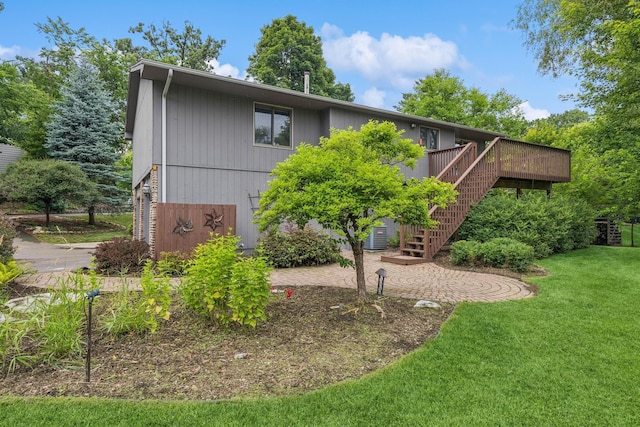 551 Townes Rd, Minnetonka, MN 55391 - view of home's exterior featuring stairway, a lawn, and a deck