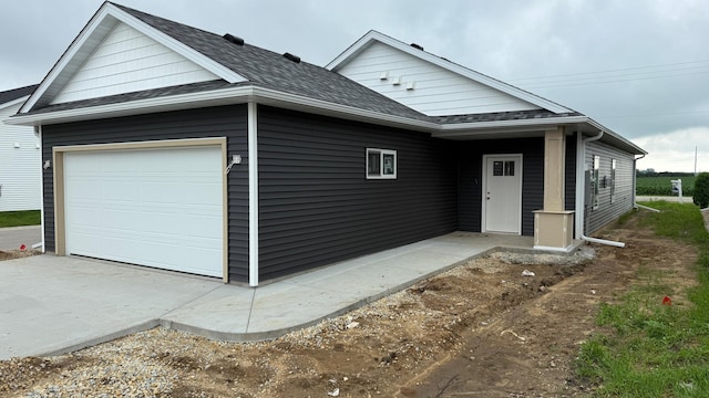 1400 Prairie Pl NW, Kasson, MN 55944 - view of front of property featuring a shingled roof and an attached garage