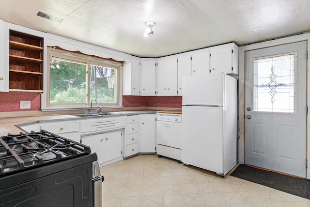 1273 County Rd N, Kinnickinnic Twp, WI 54023 - kitchen with white appliances, light floors, plenty of natural light, and white cabinetry