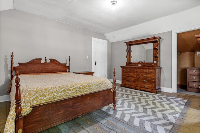 1273 County Rd N, Kinnickinnic Twp, WI 54023 - bedroom with vaulted ceiling and wood-type flooring