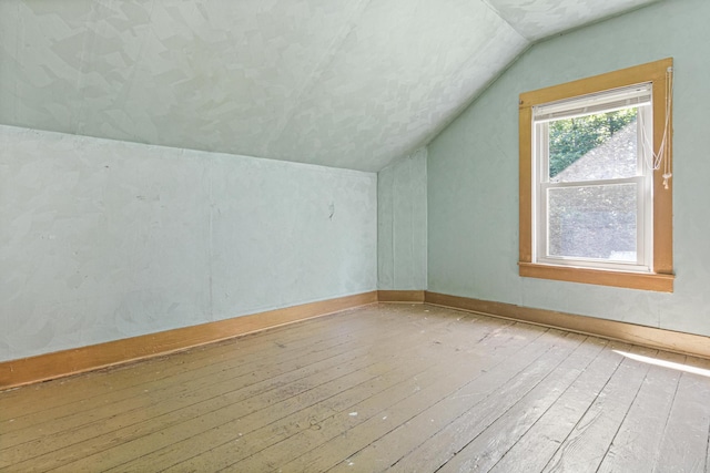 1273 County Rd N, Kinnickinnic Twp, WI 54023 - additional living space featuring vaulted ceiling and hardwood / wood-style floors