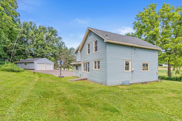 1273 County Rd N, Kinnickinnic Twp, WI 54023 - view of home's exterior with a garage, an outbuilding, and a lawn