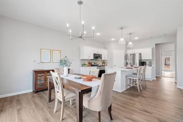 2452 Greenbriar Ln, Buffalo, MN 55313 - dining room featuring recessed lighting, light wood-type flooring, and a chandelier