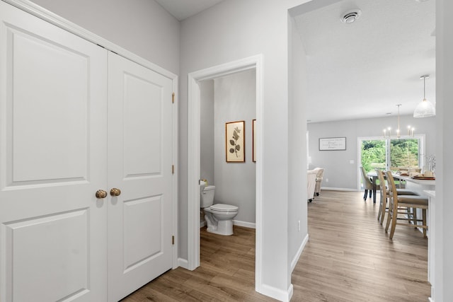2452 Greenbriar Ln, Buffalo, MN 55313 - hall with wood finished floors and a chandelier