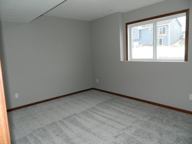 2109 6th Ave NE, Kasson, MN 55944 - carpeted spare room with baseboards