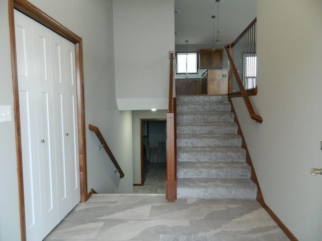 2109 6th Ave NE, Kasson, MN 55944 - stairs featuring baseboards
