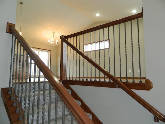 2109 6th Ave NE, Kasson, MN 55944 - staircase featuring a chandelier, lofted ceiling, and recessed lighting