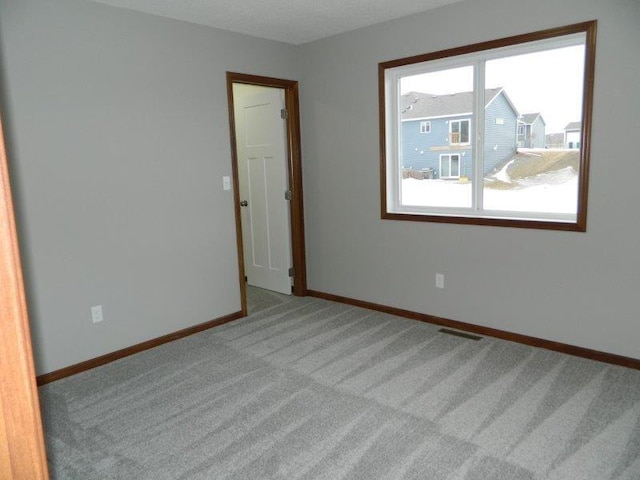 2109 6th Ave NE, Kasson, MN 55944 - spare room with carpet and baseboards