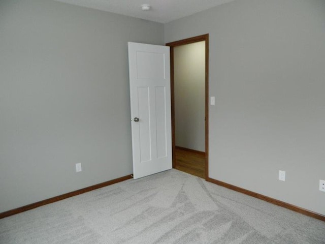 2109 6th Ave NE, Kasson, MN 55944 - empty room with carpet and baseboards