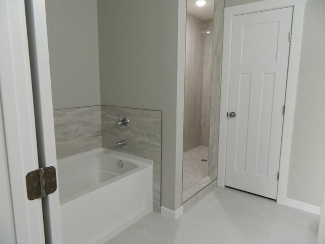 2109 6th Ave NE, Kasson, MN 55944 - bathroom featuring a bath, walk in shower, and tile patterned flooring