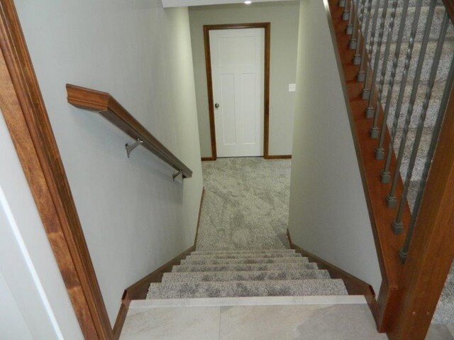 2109 6th Ave NE, Kasson, MN 55944 - stairway with baseboards and carpet flooring