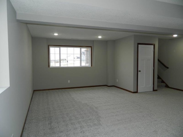 2109 6th Ave NE, Kasson, MN 55944 - unfurnished room with light carpet, stairs, recessed lighting, and a textured ceiling