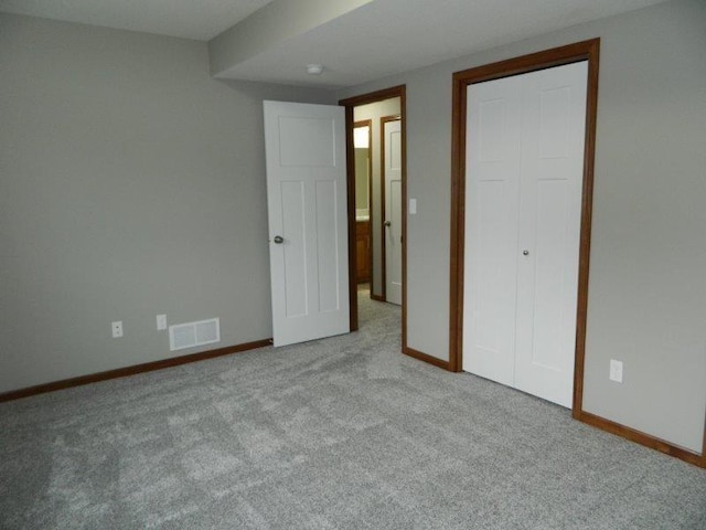 2109 6th Ave NE, Kasson, MN 55944 - unfurnished bedroom featuring carpet and a closet