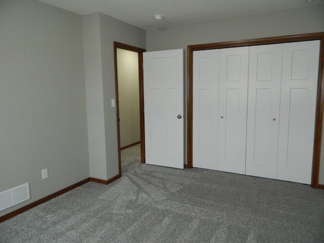 2109 6th Ave NE, Kasson, MN 55944 - unfurnished bedroom with carpet flooring and a closet