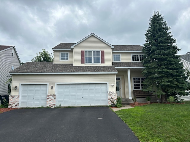 7263 Falmouth Curv, Shakopee, MN 55379 - traditional-style home with asphalt driveway, brick siding, a front lawn, and an attached garage