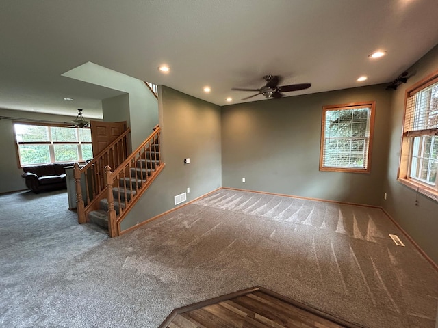 7263 Falmouth Curv, Shakopee, MN 55379 - unfurnished living room featuring ceiling fan, stairway, carpet flooring, and recessed lighting