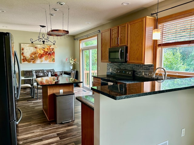 7263 Falmouth Curv, Shakopee, MN 55379 - kitchen featuring freestanding refrigerator, electric stove, dark wood-type flooring, tasteful backsplash, and dark countertops