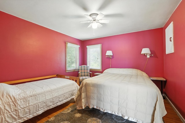 1276 County Rd Unit G, Milltown, WI 54858 - bedroom with wood finished floors and a ceiling fan