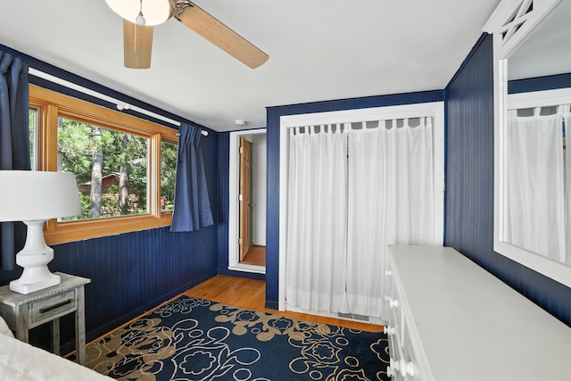 1276 County Rd Unit G, Milltown, WI 54858 - bedroom with wood finished floors and ceiling fan