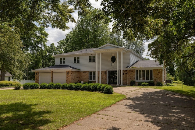405 River St SW, Chatfield, MN 55923 - greek revival house with a front yard, brick siding, and driveway