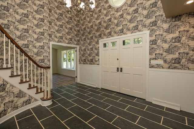 405 River St SW, Chatfield, MN 55923 - entrance foyer featuring wallpapered walls, a wainscoted wall, a chandelier, and stairway
