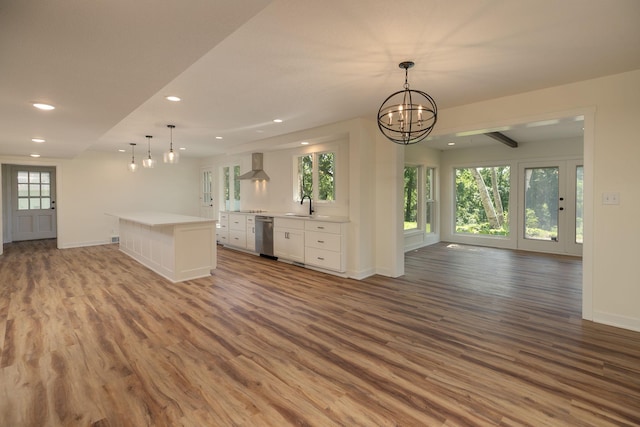 405 River St SW, Chatfield, MN 55923 - unfurnished living room with recessed lighting, wood finished floors, healthy amount of natural light, and a chandelier