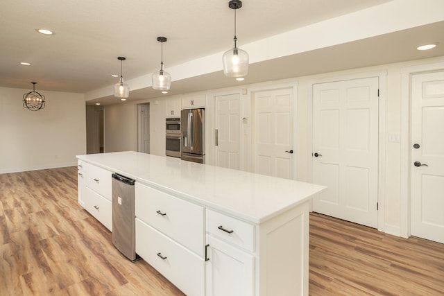 405 River St SW, Chatfield, MN 55923 - kitchen with light wood finished floors, recessed lighting, white cabinetry, stainless steel refrigerator with ice dispenser, and a kitchen island
