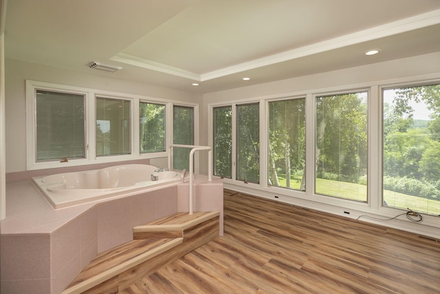 405 River St SW, Chatfield, MN 55923 - bathroom featuring a bath, wood finished floors, recessed lighting, and a raised ceiling