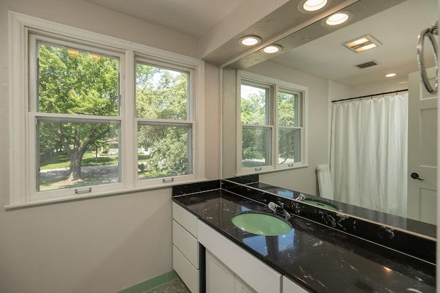 405 River St SW, Chatfield, MN 55923 - full bathroom with vanity, healthy amount of natural light, and recessed lighting