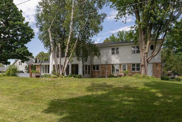 405 River St SW, Chatfield, MN 55923 - rear view of house featuring brick siding and a yard