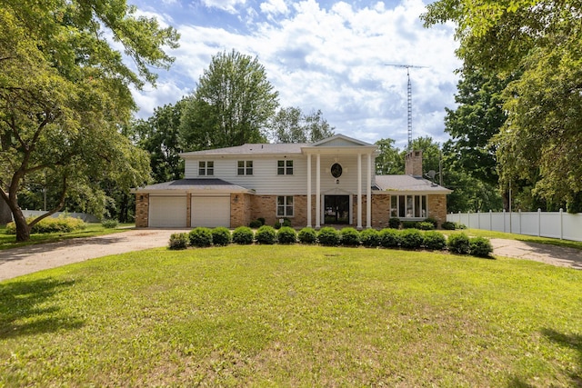 405 River St SW, Chatfield, MN 55923 - greek revival house with driveway, brick siding, and a chimney