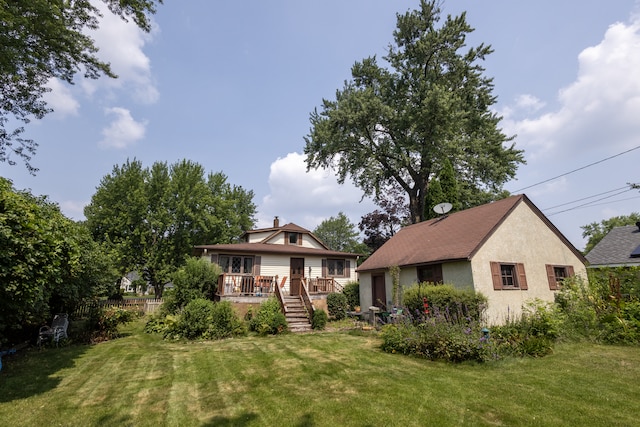 3979 Reservoir Blvd, Columbia Heights, MN 55421 - view of front of house with a wooden deck, stucco siding, and stairway