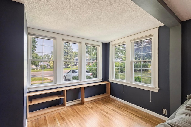 3979 Reservoir Blvd, Columbia Heights, MN 55421 - unfurnished room with wood finished floors and a textured ceiling