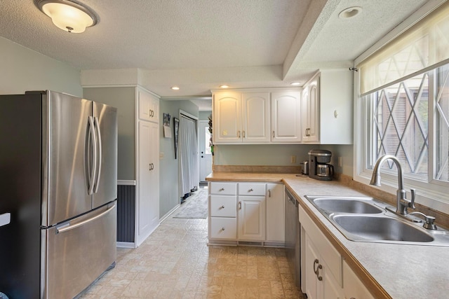 3979 Reservoir Blvd, Columbia Heights, MN 55421 - kitchen featuring appliances with stainless steel finishes, a textured ceiling, white cabinetry, light countertops, and recessed lighting