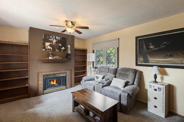 3979 Reservoir Blvd, Columbia Heights, MN 55421 - carpeted living room with ceiling fan, a fireplace, and a textured ceiling
