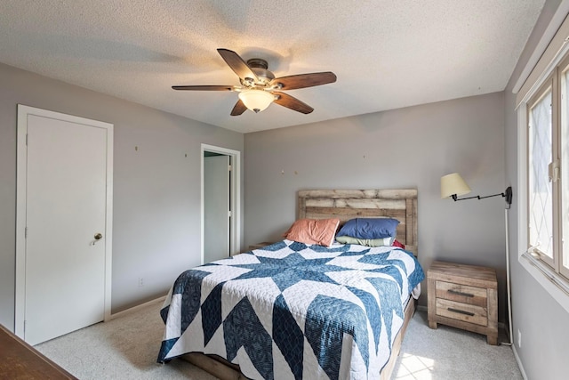 3979 Reservoir Blvd, Columbia Heights, MN 55421 - bedroom featuring light carpet, multiple windows, a textured ceiling, and a ceiling fan
