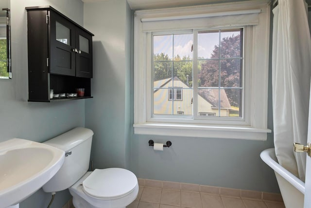 3979 Reservoir Blvd, Columbia Heights, MN 55421 - full bathroom featuring a freestanding bath and tile patterned floors
