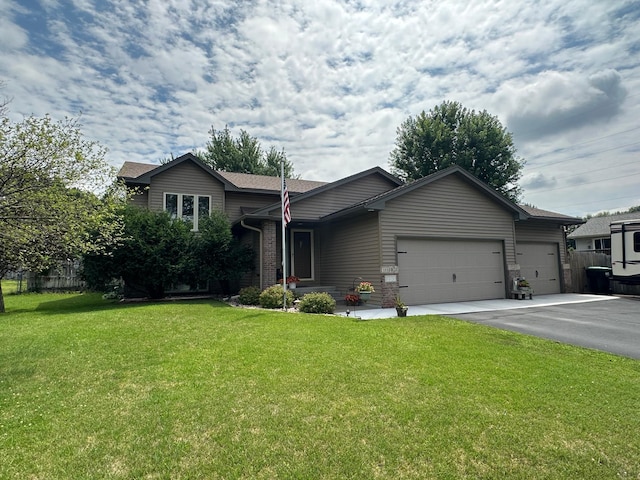 12313 Ilex St NW, Coon Rapids, MN 55448 - tri-level home featuring an attached garage and driveway