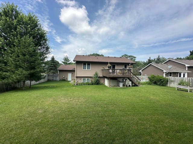 12313 Ilex St NW, Coon Rapids, MN 55448 - rear view of house featuring stairs, a wooden deck, and a fenced backyard
