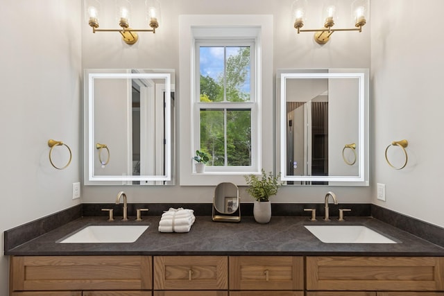 2850 Victoria St N, Roseville, MN 55113 - full bathroom featuring double vanity and a chandelier