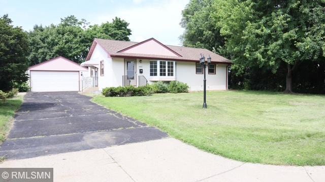 6007 Vincent Ave N, Brooklyn Center, MN 55430 - ranch-style home with an outbuilding, a garage, a front lawn, and stucco siding