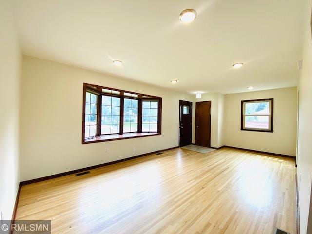 6007 Vincent Ave N, Brooklyn Center, MN 55430 - empty room featuring light wood-type flooring and baseboards