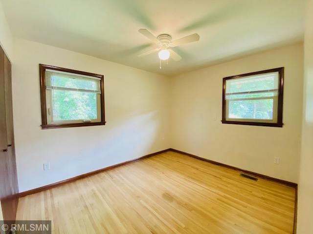 6007 Vincent Ave N, Brooklyn Center, MN 55430 - empty room featuring light wood-style floors and ceiling fan