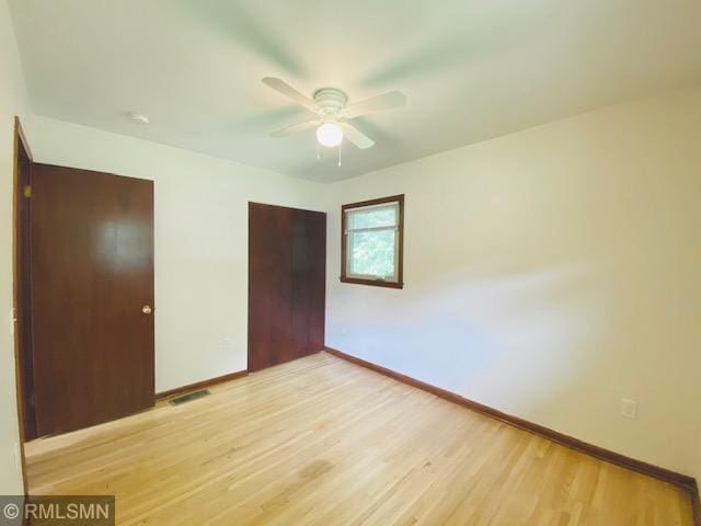 6007 Vincent Ave N, Brooklyn Center, MN 55430 - unfurnished bedroom featuring light wood-type flooring and ceiling fan