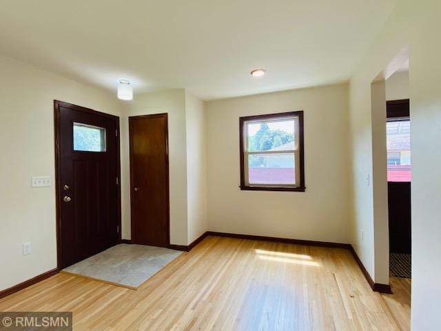 6007 Vincent Ave N, Brooklyn Center, MN 55430 - foyer with healthy amount of natural light and light wood finished floors
