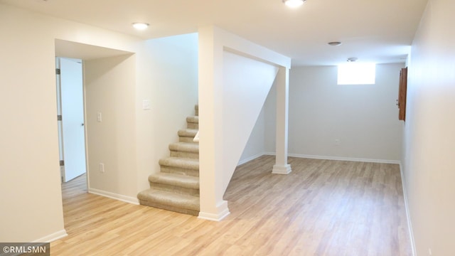 6007 Vincent Ave N, Brooklyn Center, MN 55430 - basement featuring wood finished floors and stairs